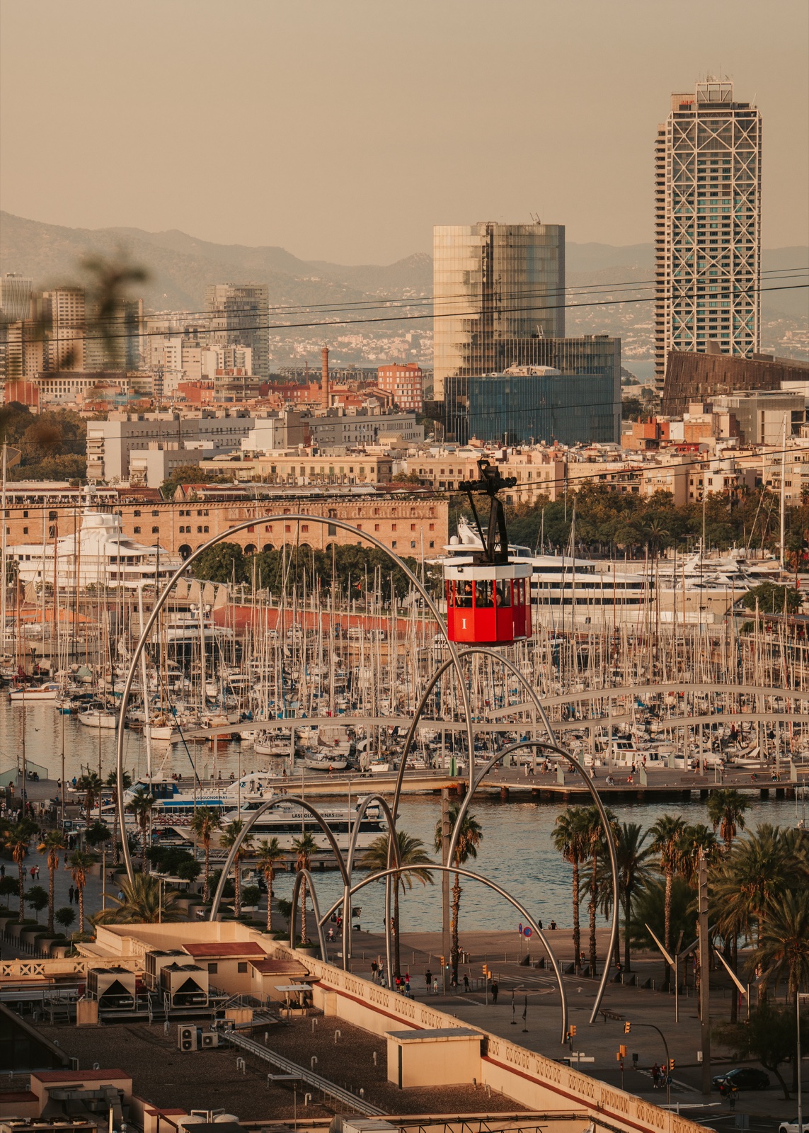 The port cable car crossing above the marina of Port Vell